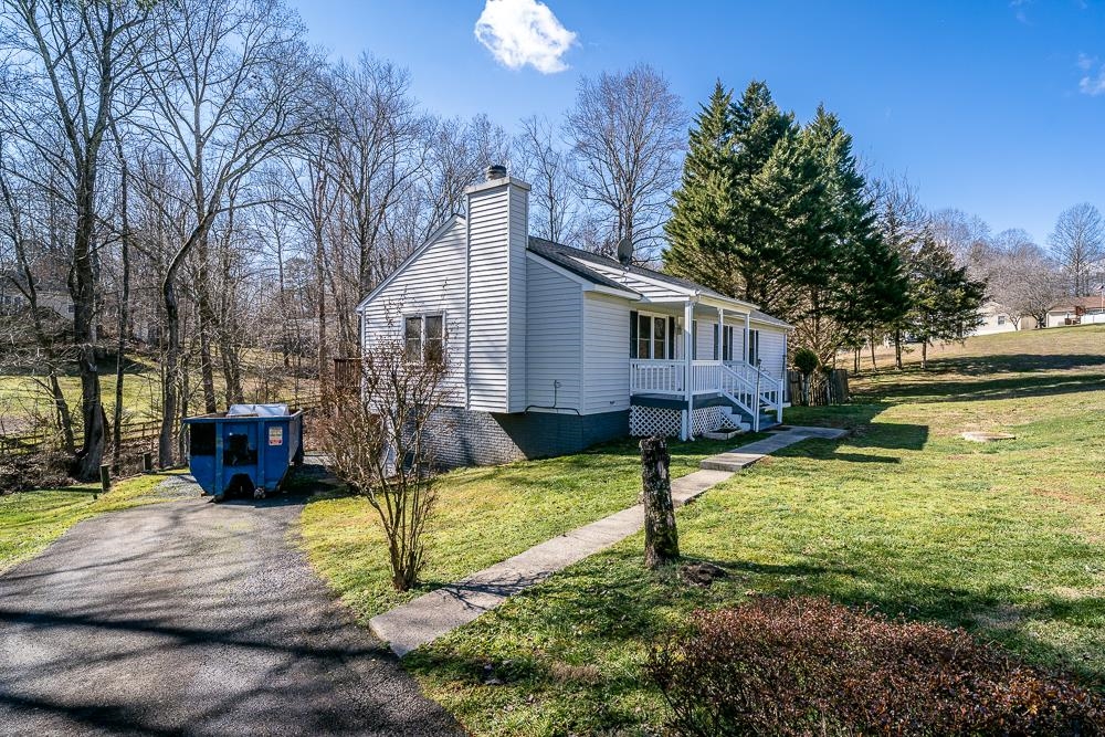 80 Phlox Road Ruckersville, VA 22968 - Photo 24 of 30 a view of a house with backyard and sitting area