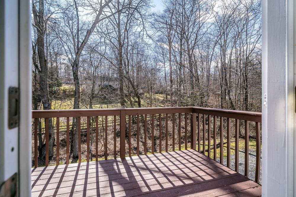 80 Phlox Road Ruckersville, VA 22968 - Photo 27 of 30 a view of a balcony with wooden floor