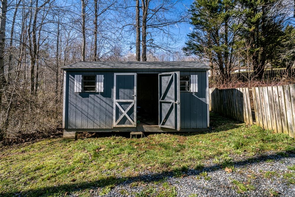 80 Phlox Road Ruckersville, VA 22968 - Photo 28 of 30 a view of a barn with big yard and large trees