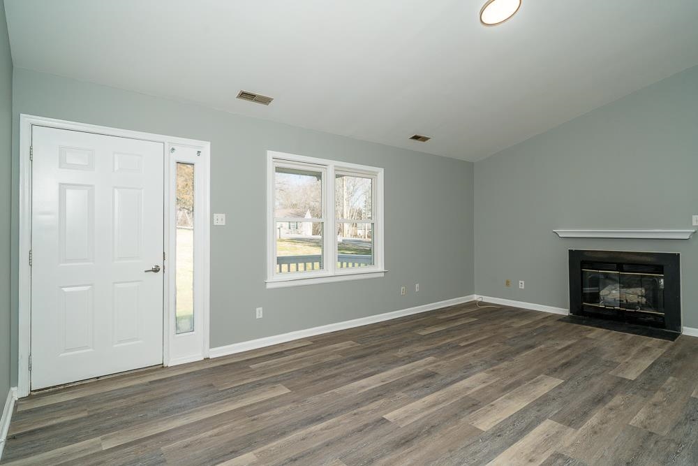 80 Phlox Road Ruckersville, VA 22968 - Photo 5 of 30 a view of an empty room with a window and fireplace