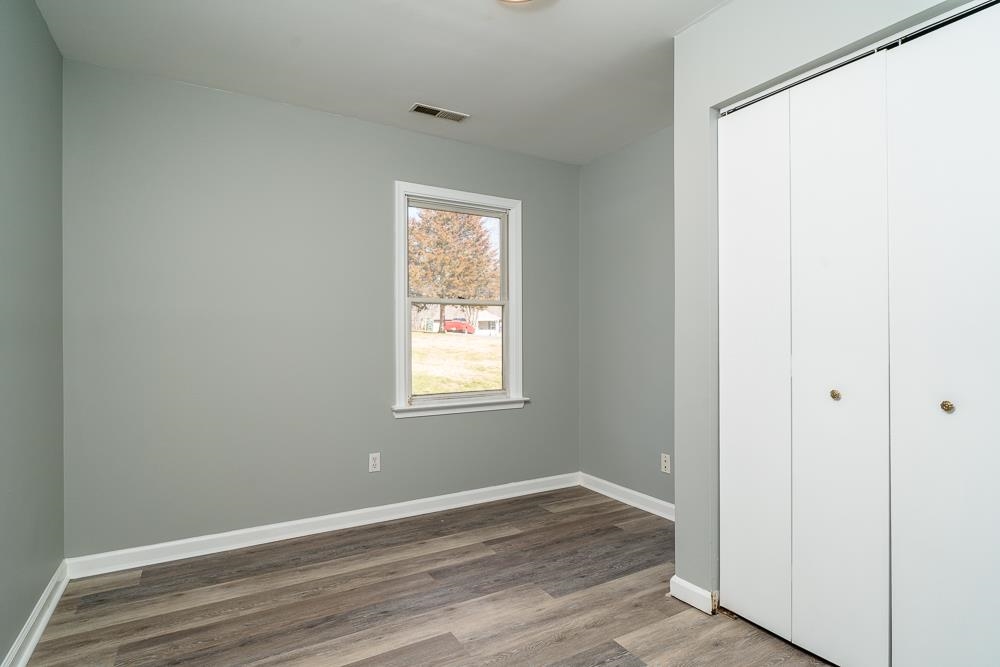80 Phlox Road Ruckersville, VA 22968 - Photo 10 of 30 an empty room with wooden floor and a window