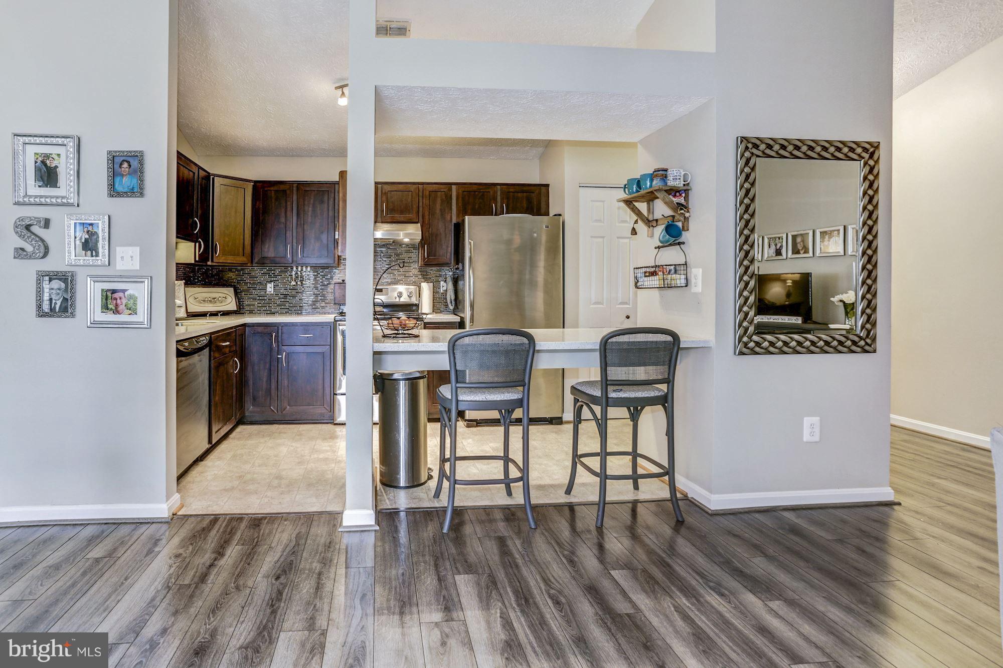 2102 Whitehall Road, Unit 2C Frederick, MD 21702 - Photo 10 of 28 a view of kitchen with livingroom and furniture