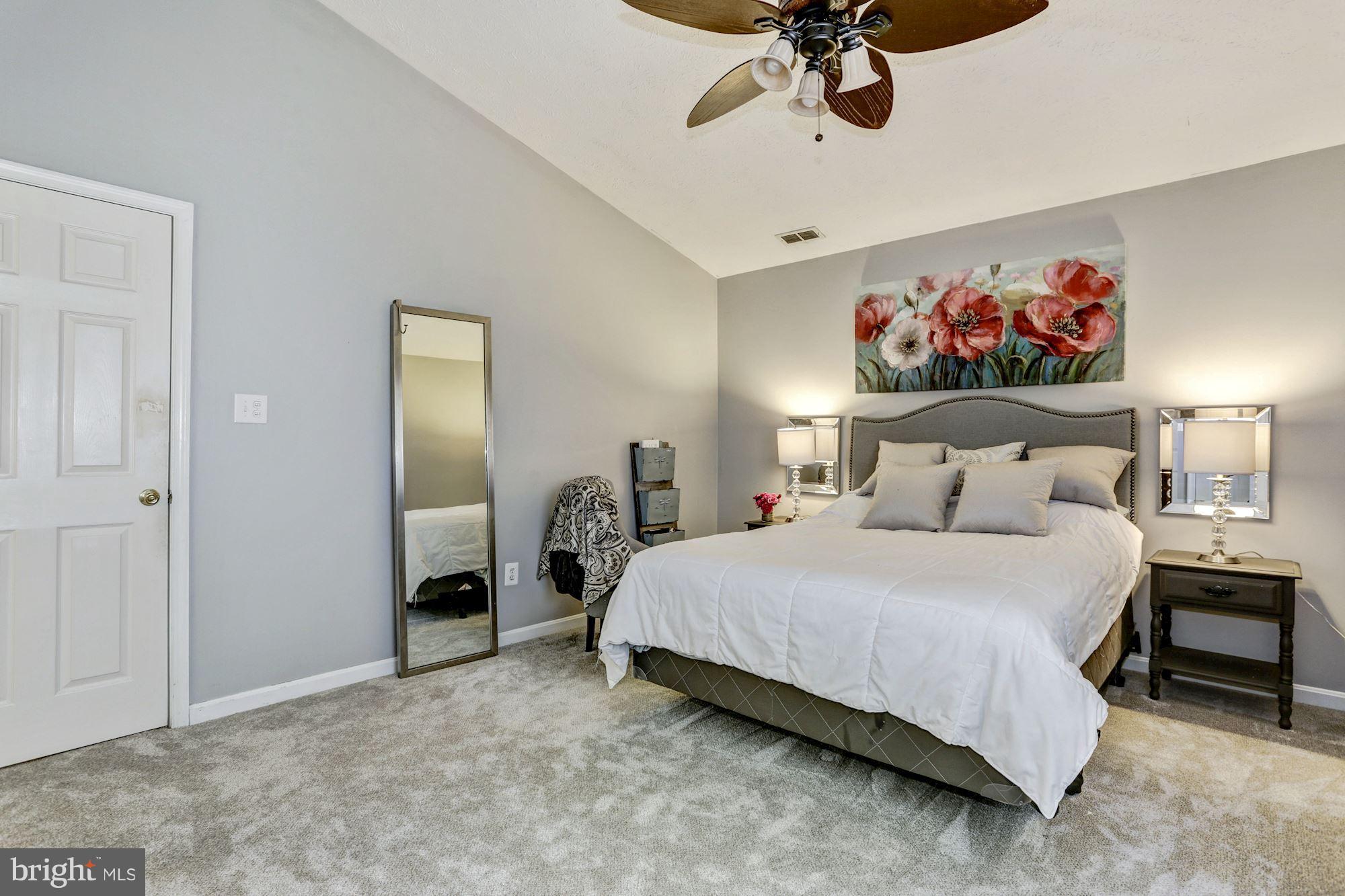 2102 Whitehall Road, Unit 2C Frederick, MD 21702 - Photo 14 of 28 a bedroom with a bed and a chandelier