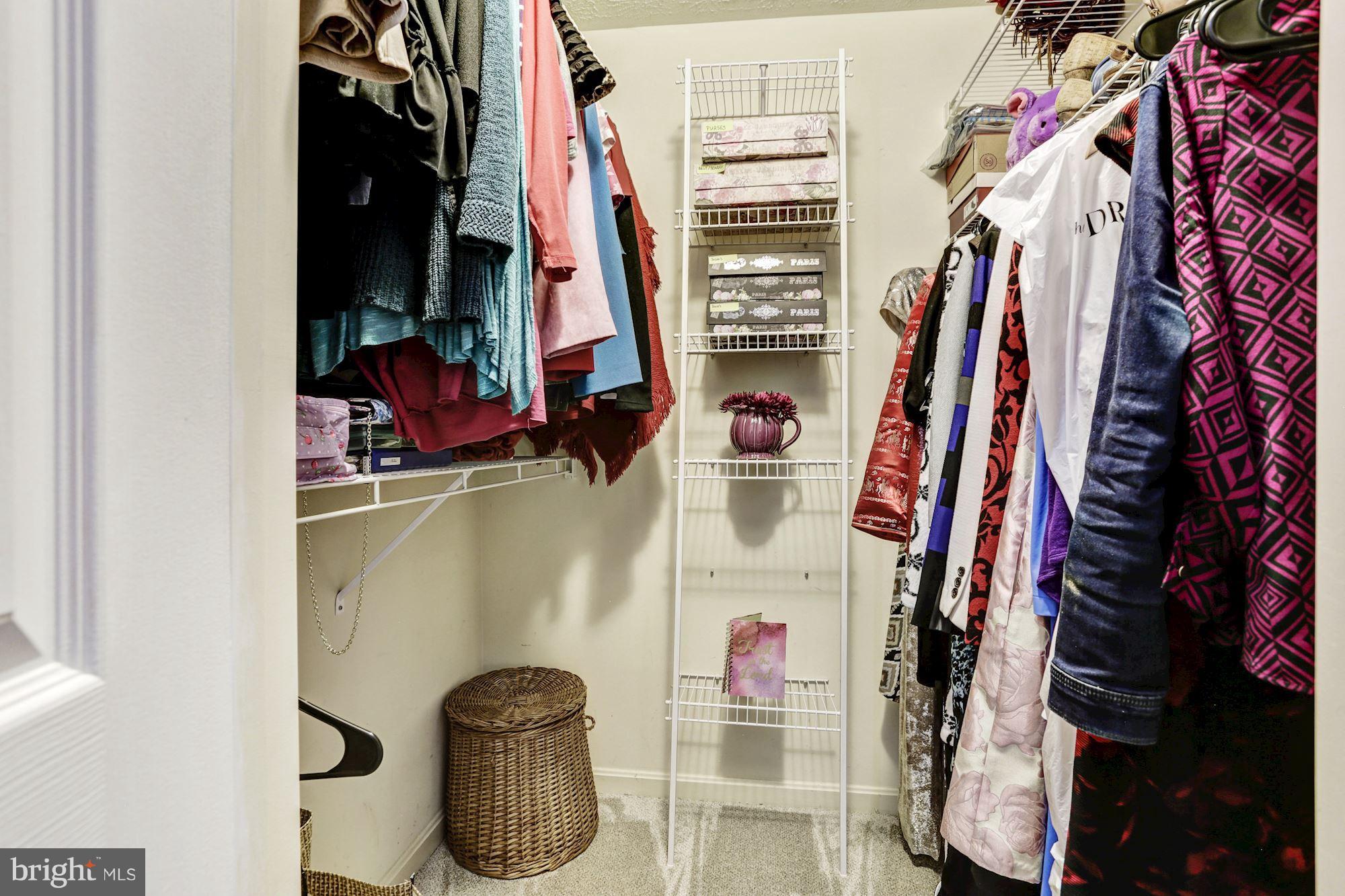 2102 Whitehall Road, Unit 2C Frederick, MD 21702 - Photo 16 of 28 a view of walk in closet with clothes and shoes