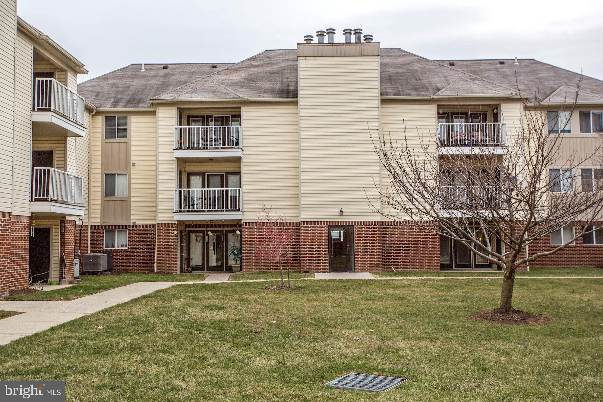 2102 Whitehall Road, Unit 2C Frederick, MD 21702 - Photo 25 of 28 a front view of house with yard