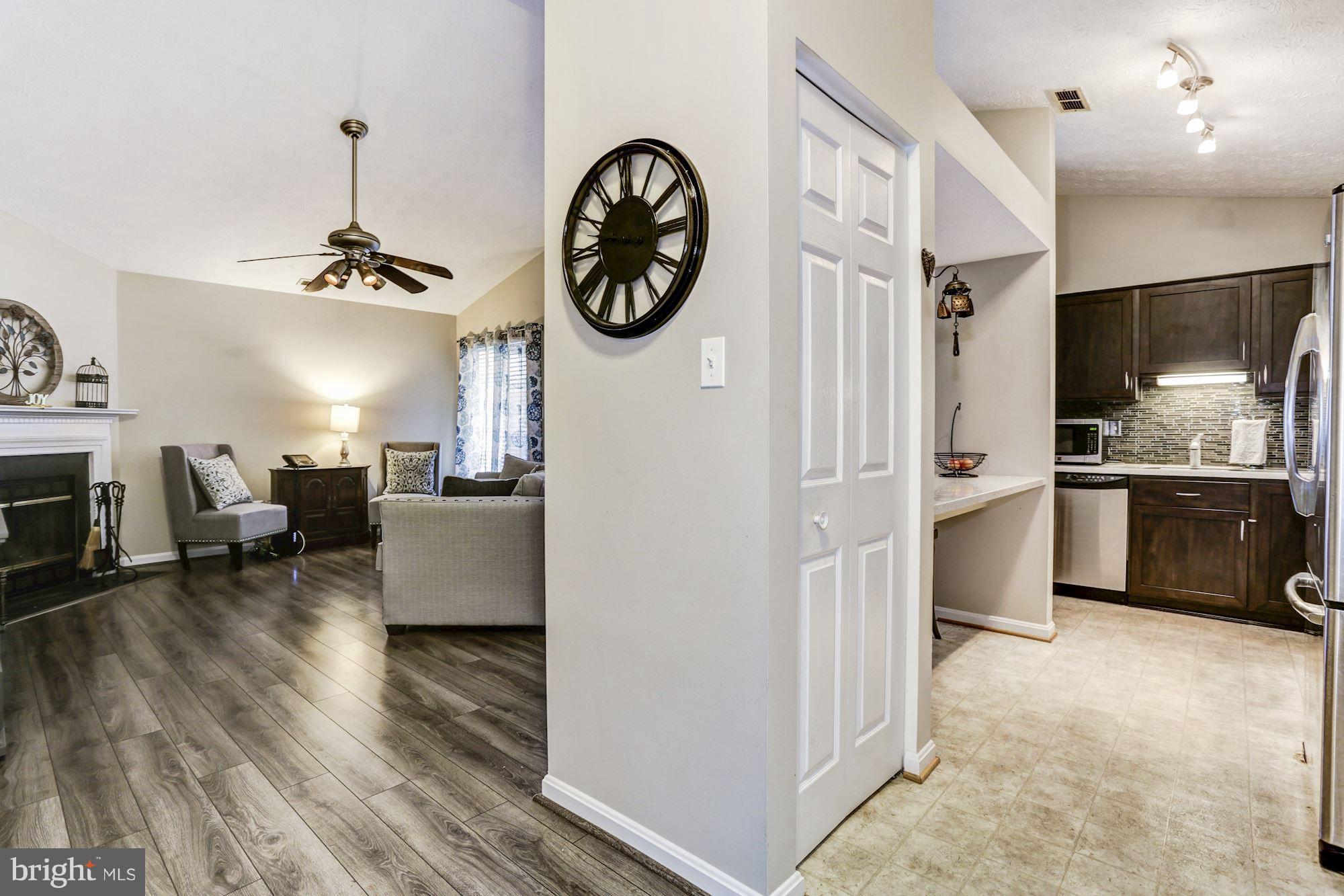 2102 Whitehall Road, Unit 2C Frederick, MD 21702 - Photo 4 of 28 a view of a living room kitchen and a wooden floor