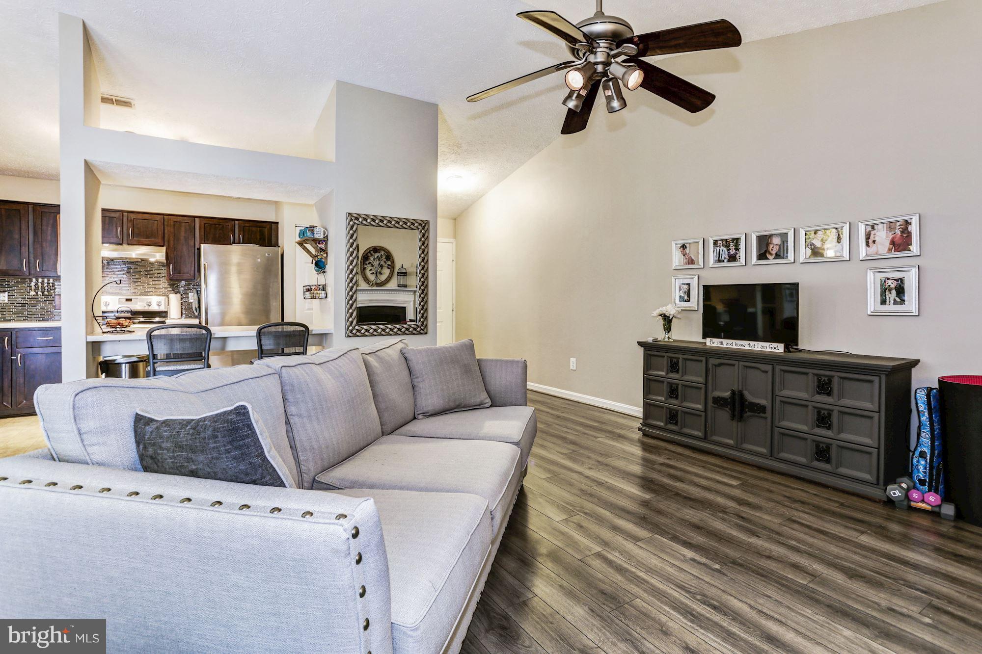 2102 Whitehall Road, Unit 2C Frederick, MD 21702 - Photo 6 of 28 a living room with furniture and a flat screen tv