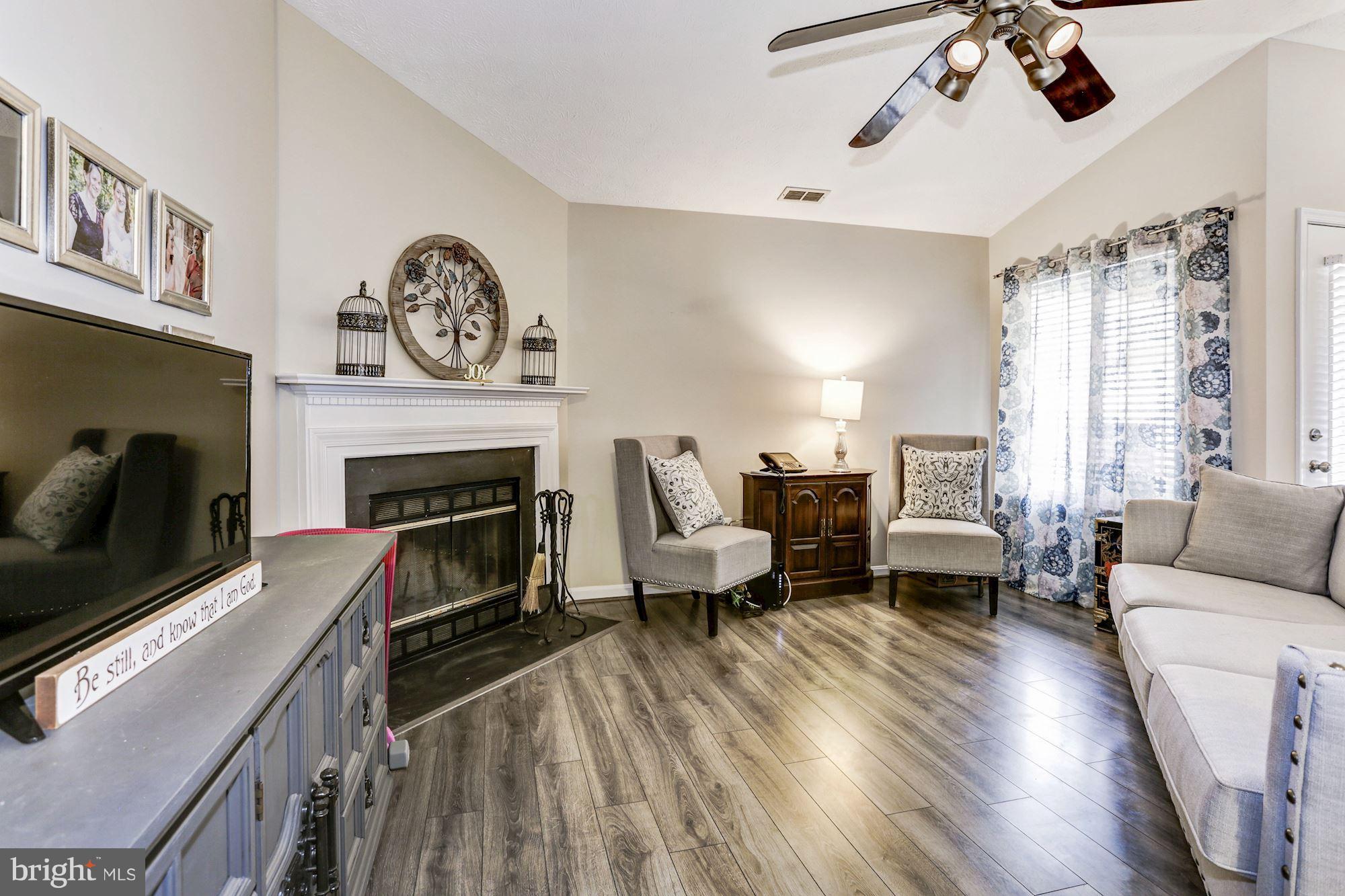 2102 Whitehall Road, Unit 2C Frederick, MD 21702 - Photo 8 of 28 a living room with furniture and a fireplace