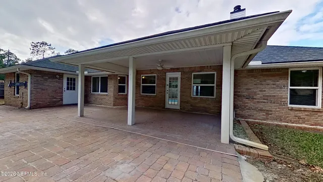 a view of a house with a garage and a balcony
