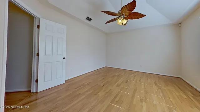 a view of an empty room with a window