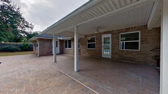 a view of a house with a yard and garage