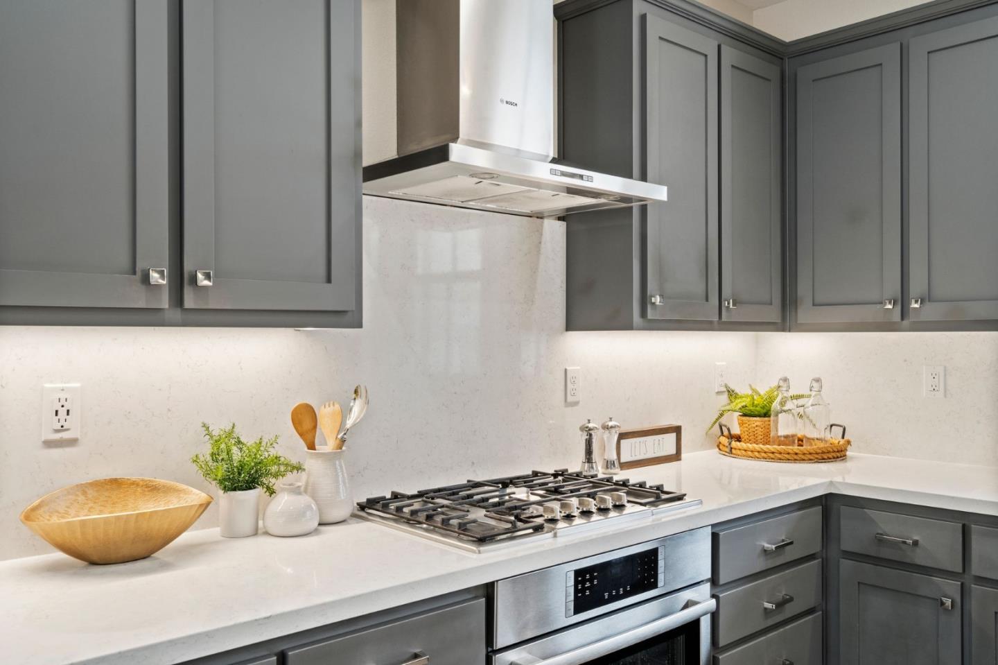 192 Melia Loop Mountain View, CA 94043 - Photo 12 of 40 a kitchen with stainless steel appliances granite countertop a sink a stove and cabinets