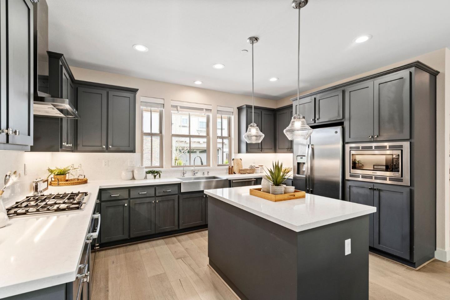 192 Melia Loop Mountain View, CA 94043 - Photo 16 of 40 a kitchen with granite countertop a sink stove refrigerator and cabinets