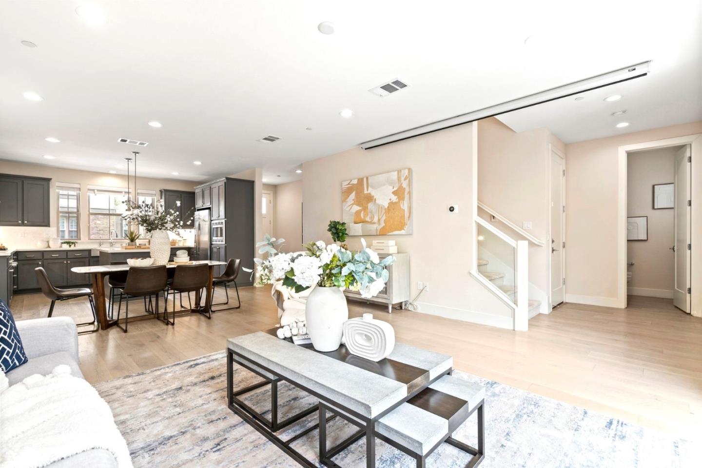 192 Melia Loop Mountain View, CA 94043 - Photo 17 of 40 a living room with furniture and a dining table with potted plant