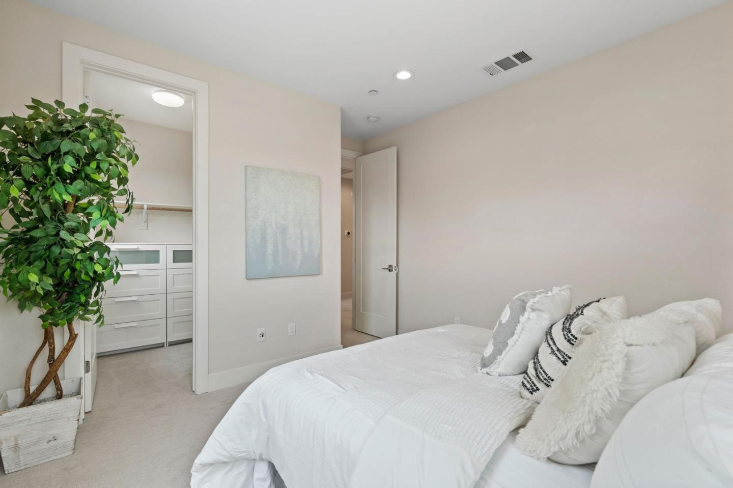 192 Melia Loop Mountain View, CA 94043 - Photo 24 of 40 a bedroom with a bed and a potted plant