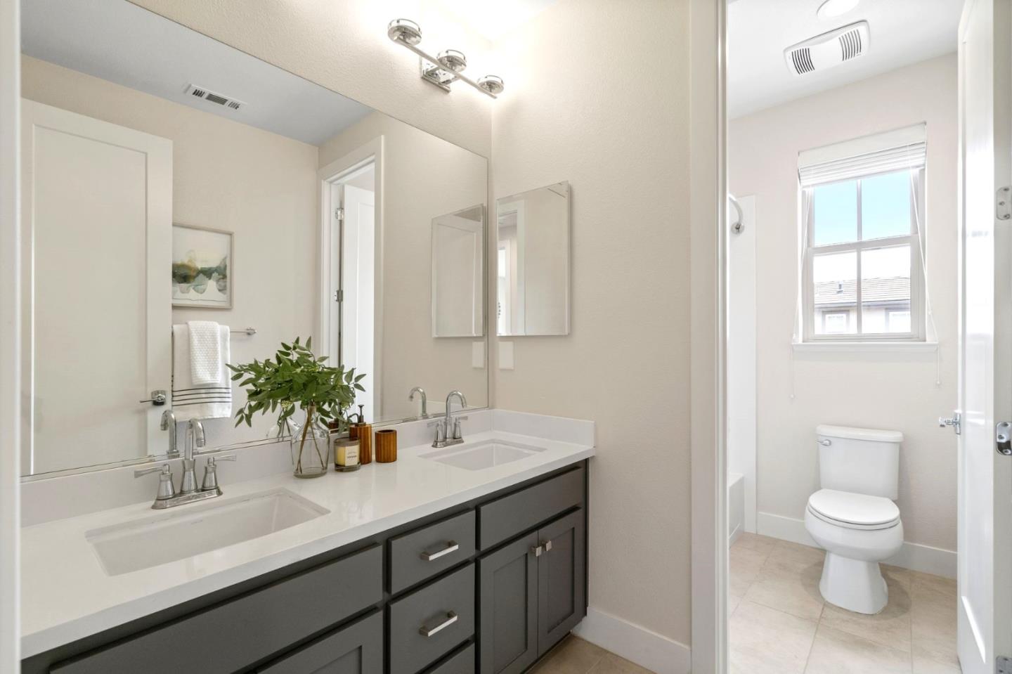 192 Melia Loop Mountain View, CA 94043 - Photo 33 of 40 a bathroom with a sink a toilet and a mirror