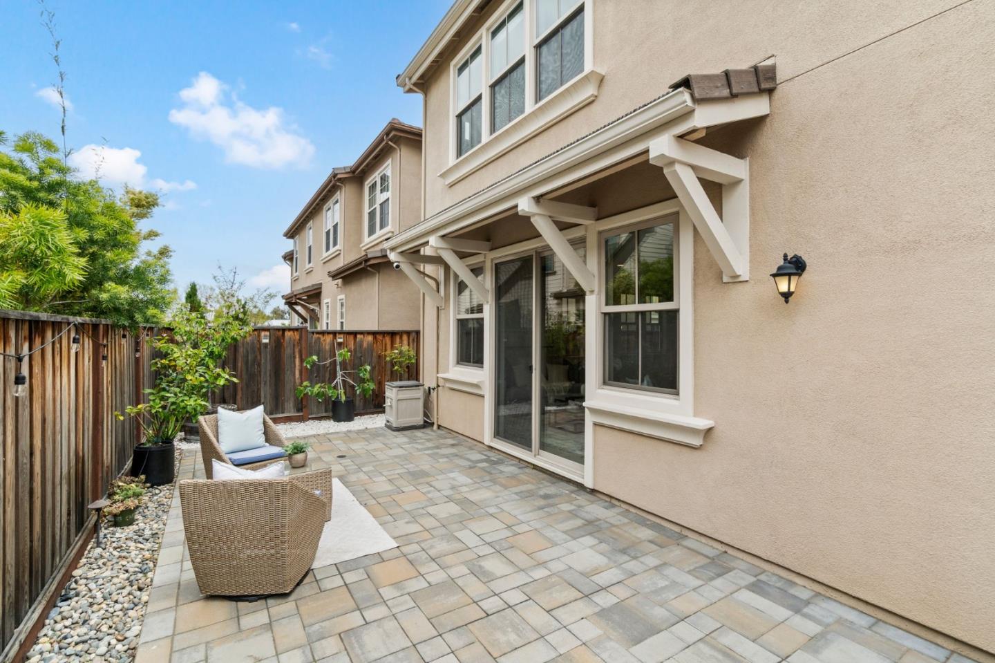 192 Melia Loop Mountain View, CA 94043 - Photo 36 of 40 a view of a patio with couches table and chairs and potted plants