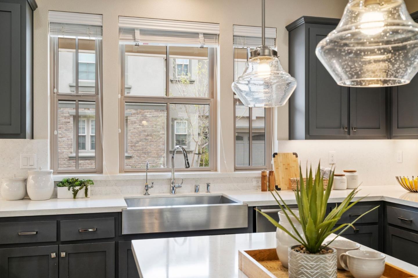 192 Melia Loop Mountain View, CA 94043 - Photo 7 of 40 a kitchen with counter top space and a chandelier