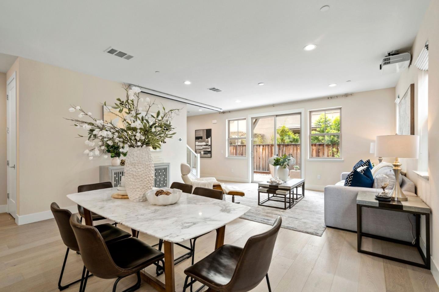 192 Melia Loop Mountain View, CA 94043 - Photo 9 of 40 a living room with furniture potted plant and floor to ceiling window