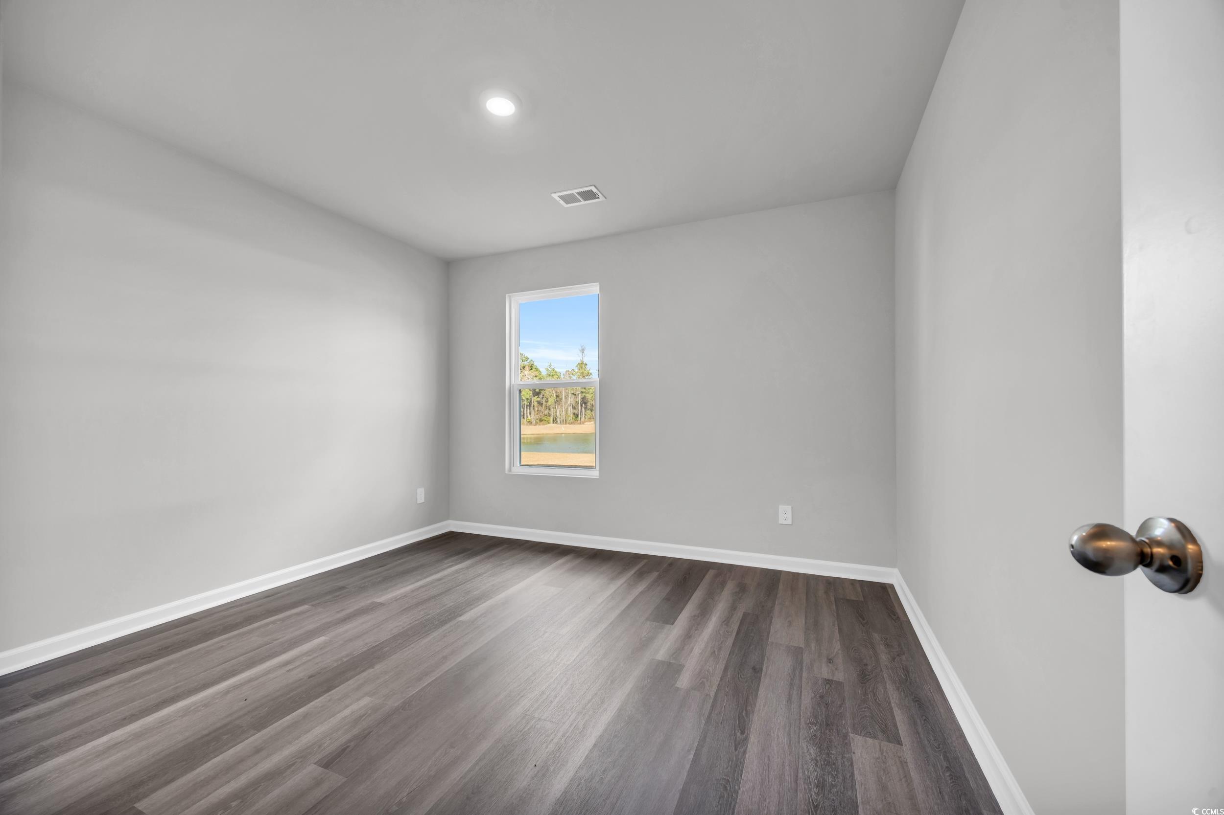 4071 Nelson Road Little River, SC 29566 - Photo 14 of 40 Unfurnished room featuring dark hardwood / wood-st