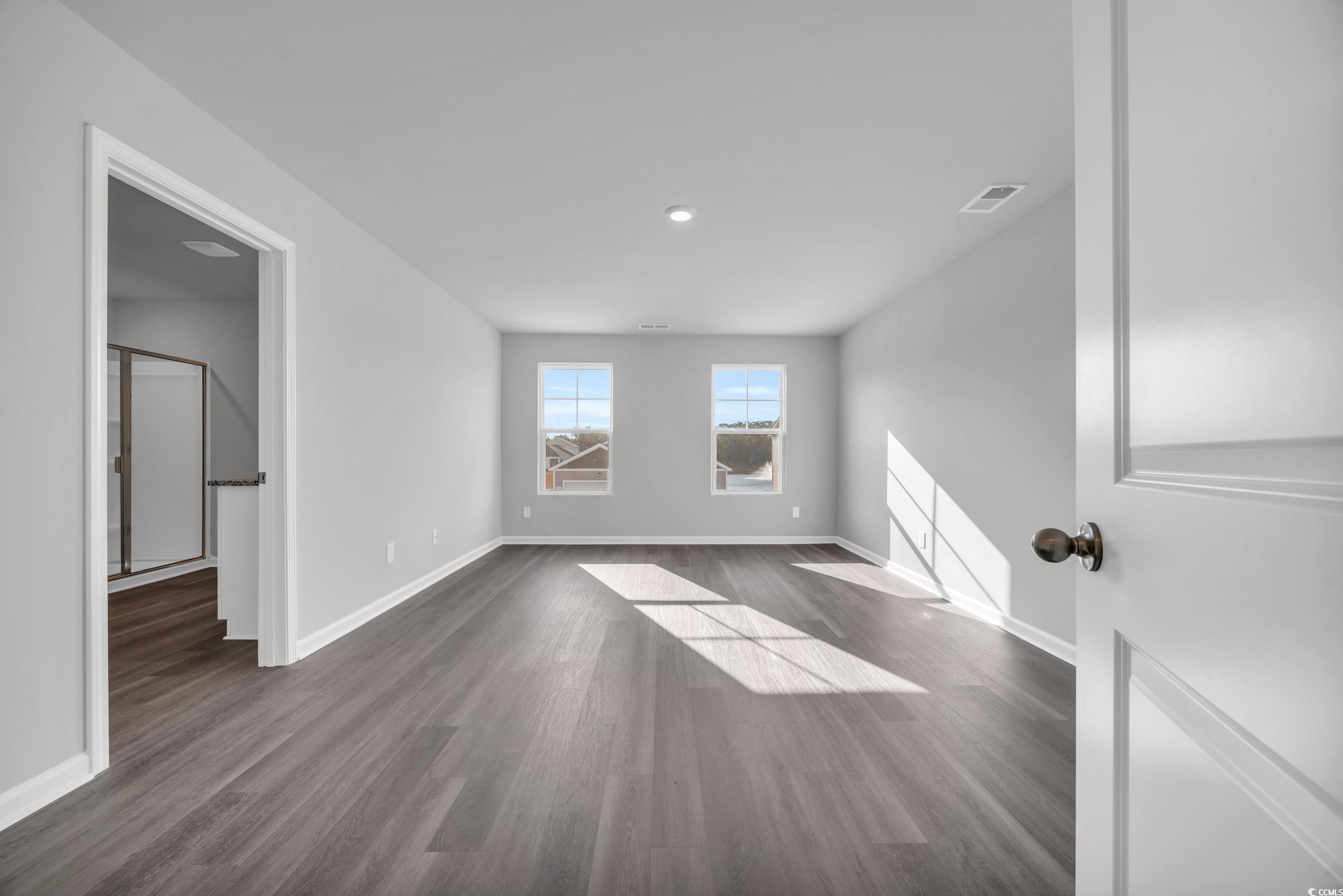4071 Nelson Road Little River, SC 29566 - Photo 18 of 40 Spare room with dark wood-type flooring