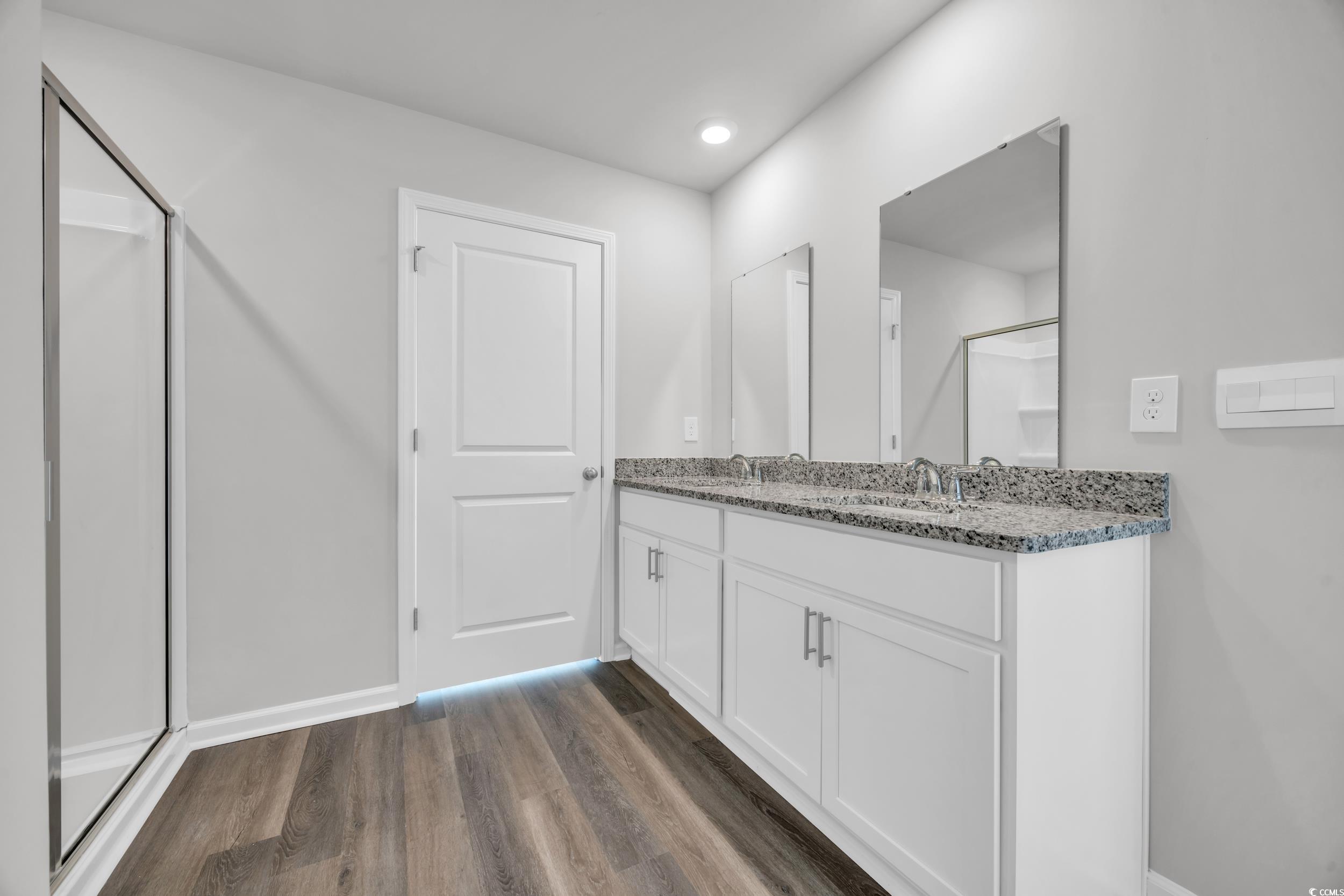 4071 Nelson Road Little River, SC 29566 - Photo 20 of 40 Bathroom with hardwood / wood-style floors, vanity