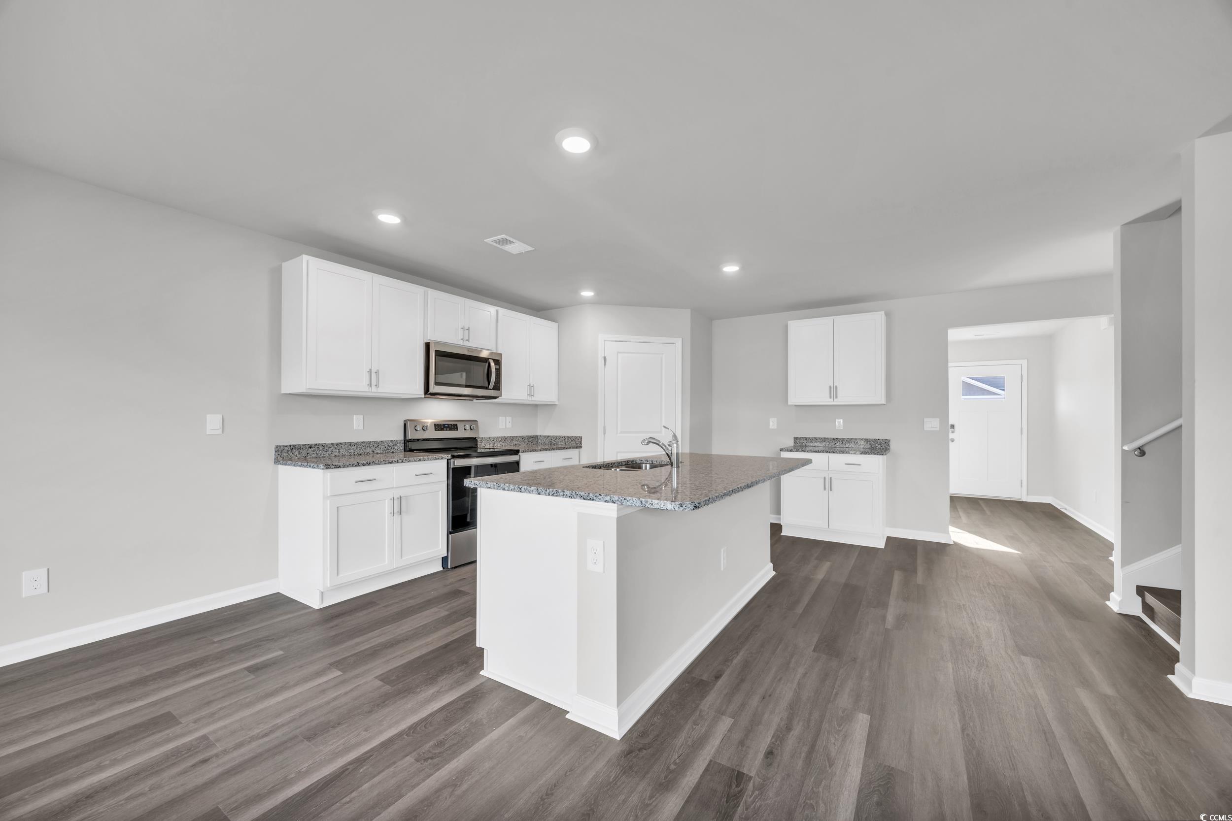 4071 Nelson Road Little River, SC 29566 - Photo 2 of 40 Kitchen featuring white cabinetry, stainless steel