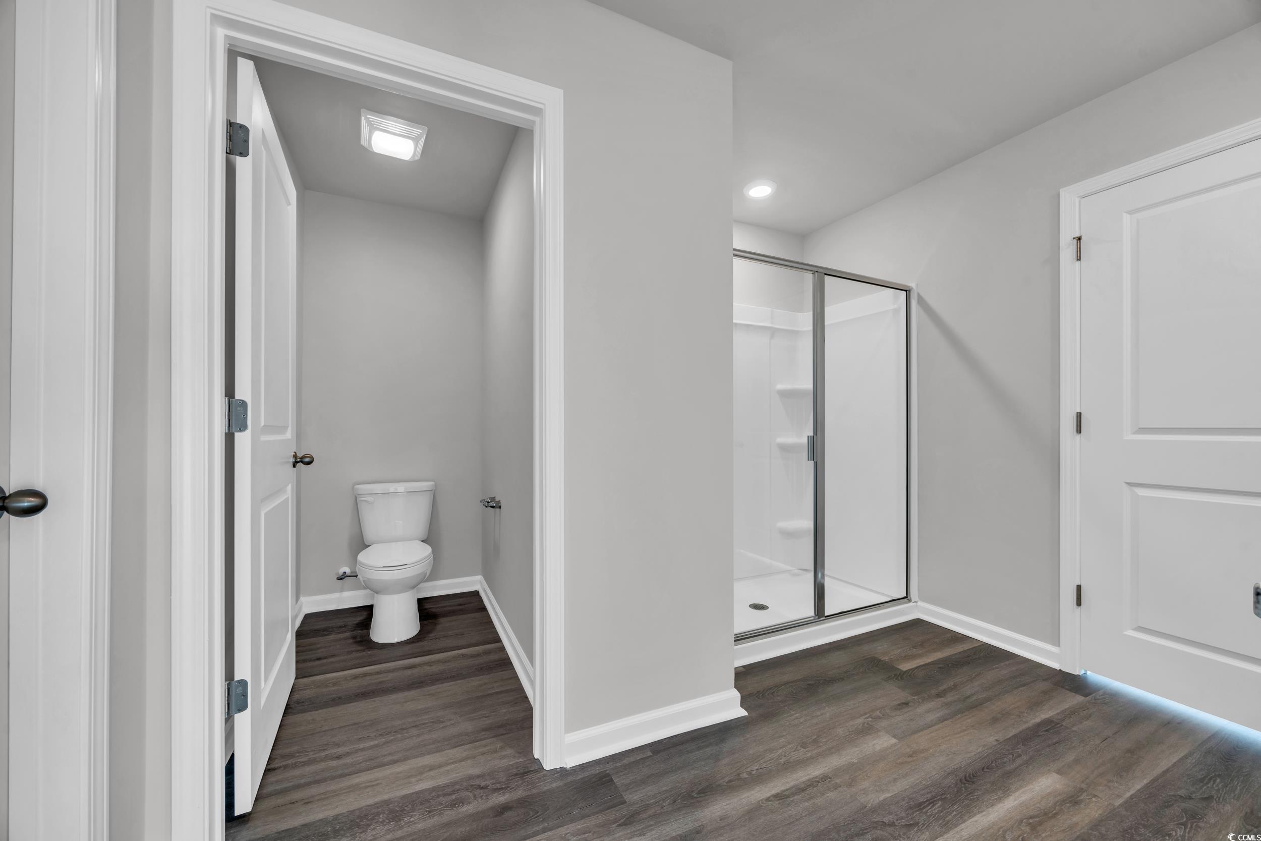 4071 Nelson Road Little River, SC 29566 - Photo 21 of 40 Bathroom with hardwood / wood-style floors, toilet
