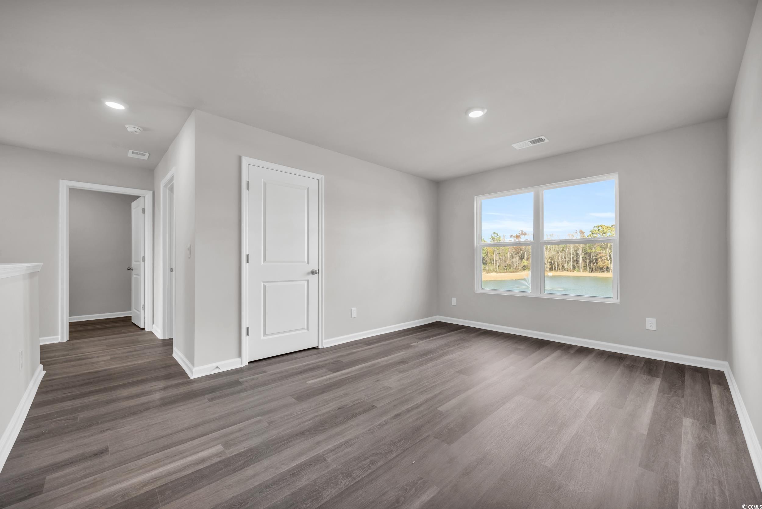4071 Nelson Road Little River, SC 29566 - Photo 25 of 40 Unfurnished room with dark hardwood / wood-style f