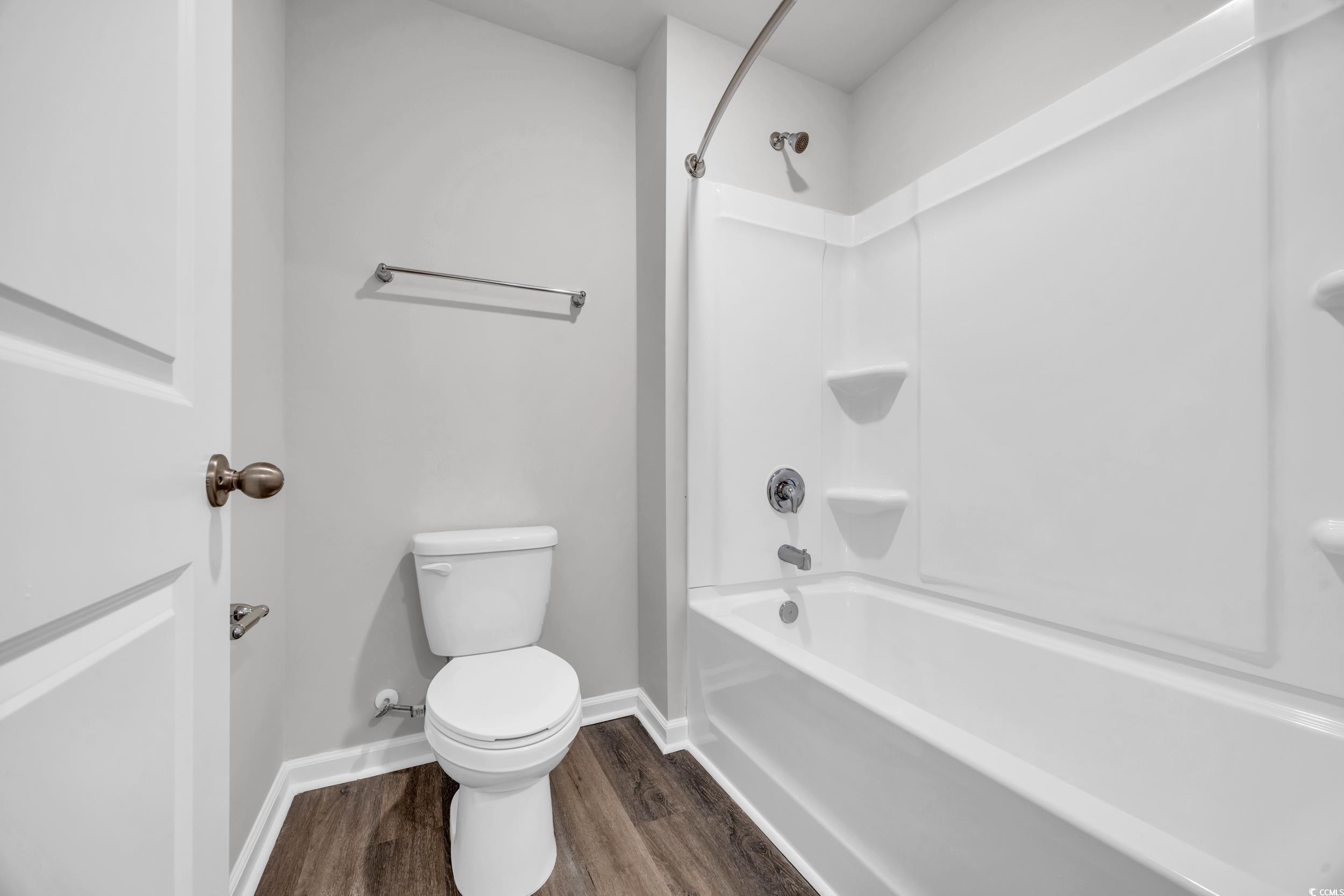 4071 Nelson Road Little River, SC 29566 - Photo 30 of 40 Bathroom featuring hardwood / wood-style floors, s