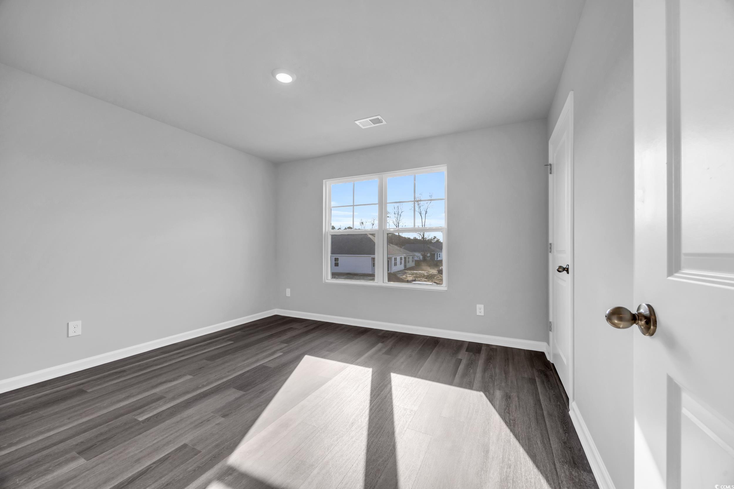 4071 Nelson Road Little River, SC 29566 - Photo 31 of 40 Unfurnished room featuring dark hardwood / wood-st