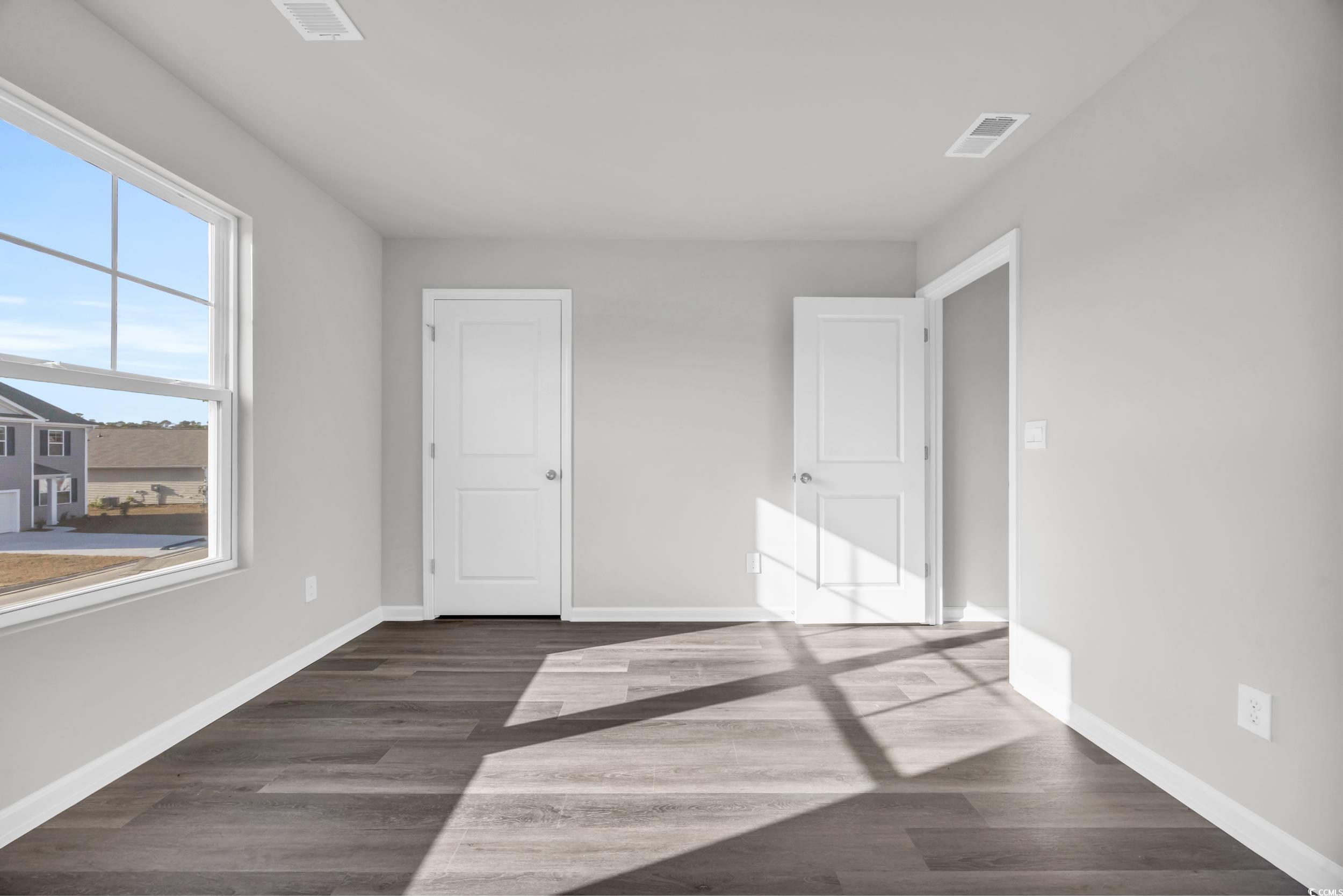 4071 Nelson Road Little River, SC 29566 - Photo 32 of 40 Unfurnished bedroom with dark hardwood / wood-styl