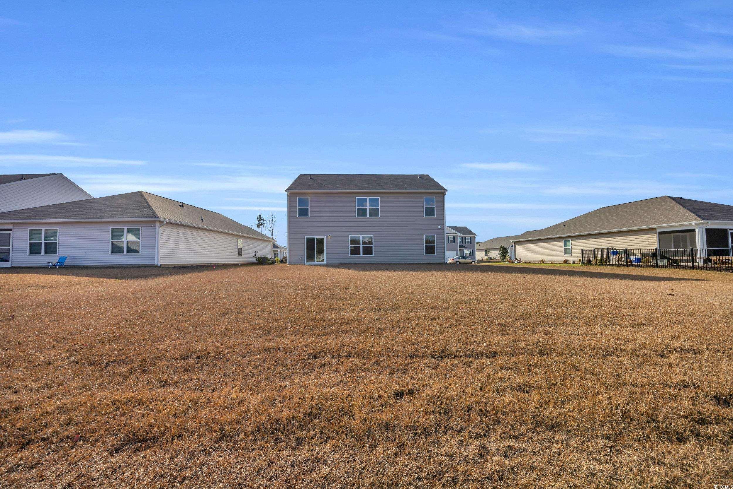 4071 Nelson Road Little River, SC 29566 - Photo 34 of 40 Back of property featuring a lawn