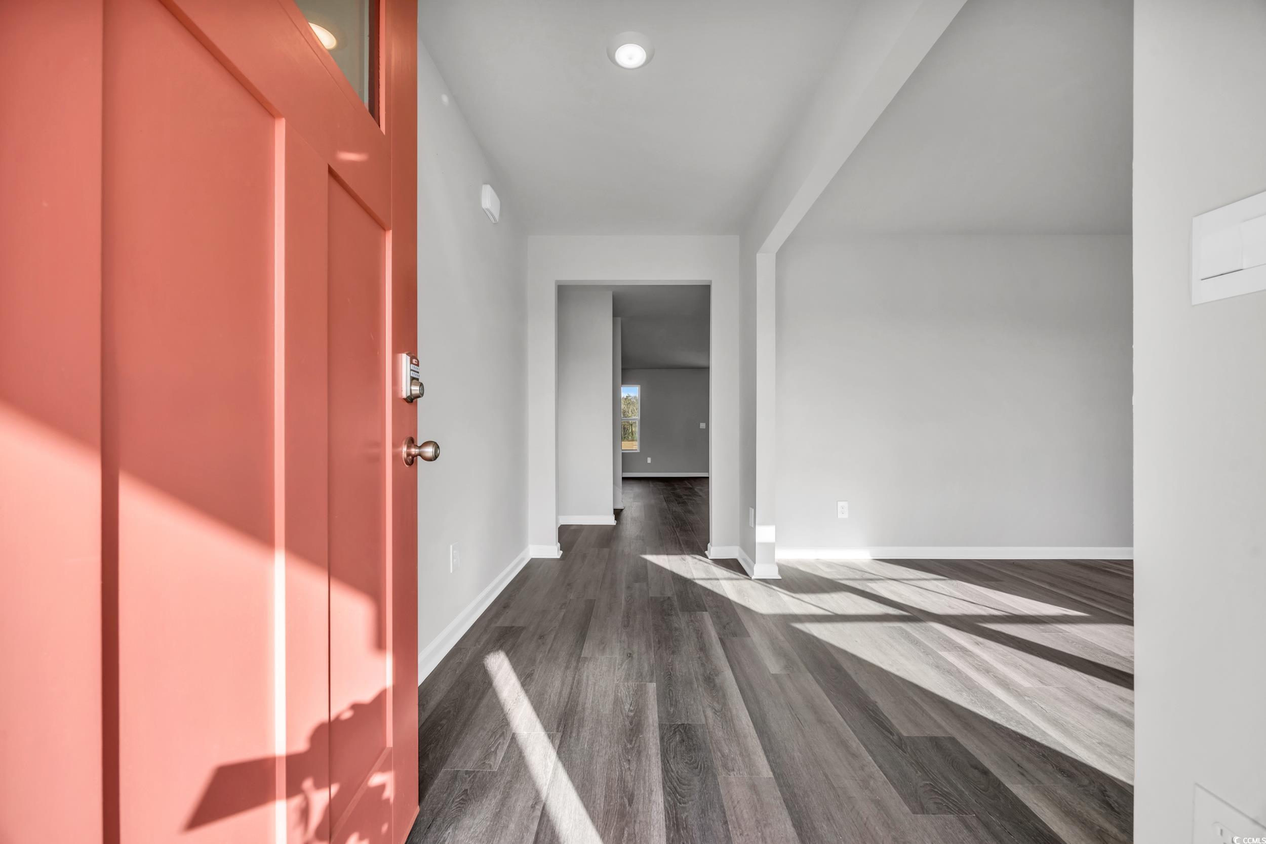 4071 Nelson Road Little River, SC 29566 - Photo 5 of 40 Hallway with dark wood-type flooring