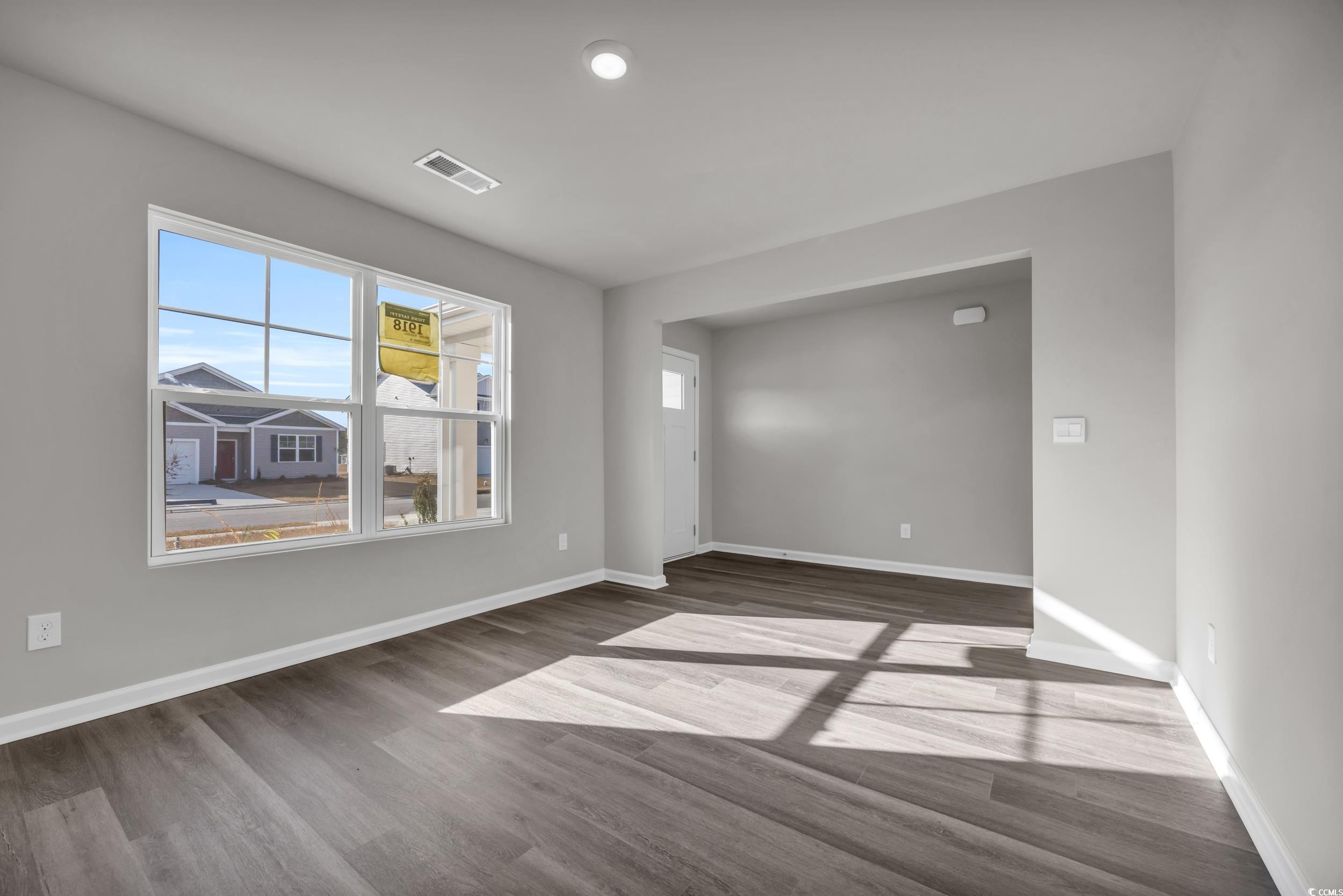 4071 Nelson Road Little River, SC 29566 - Photo 6 of 40 Unfurnished room featuring dark wood-type flooring