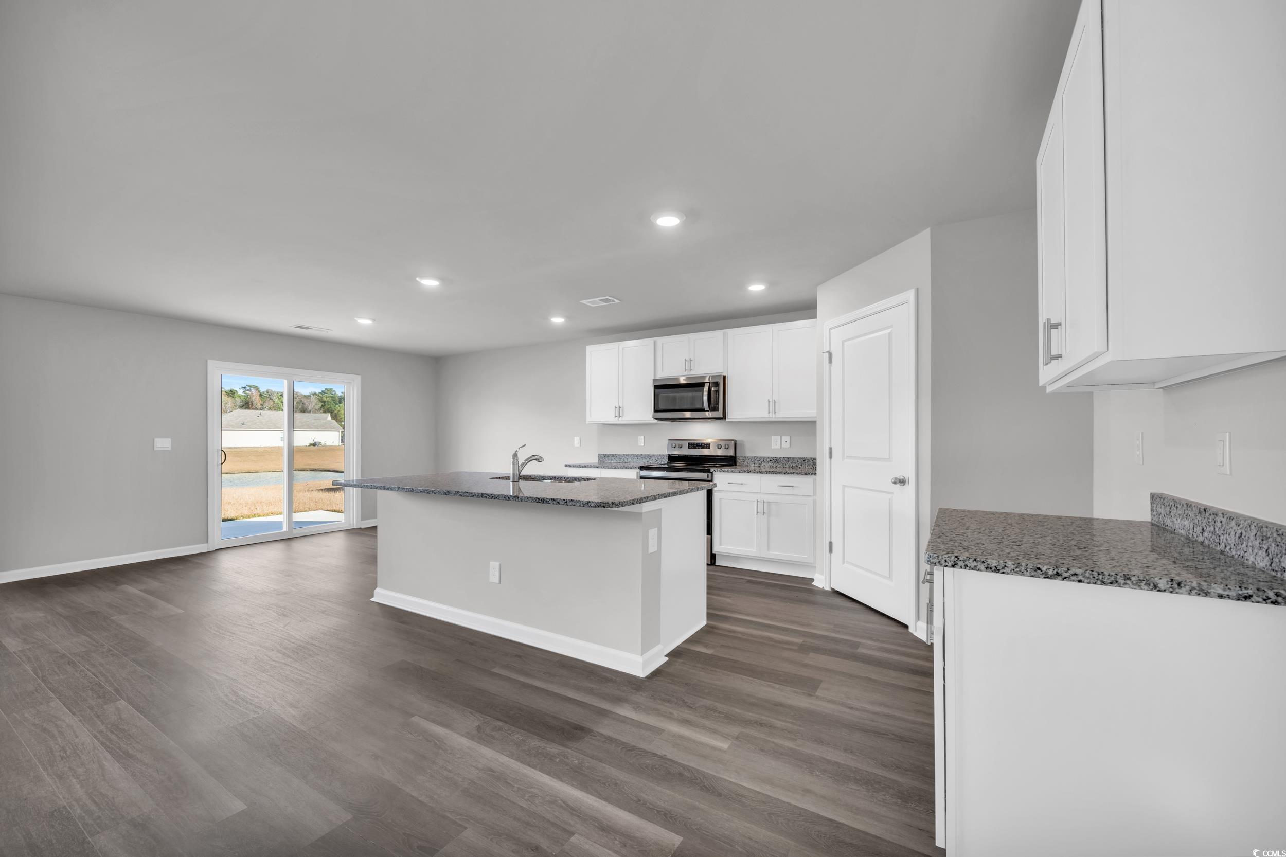 4071 Nelson Road Little River, SC 29566 - Photo 8 of 40 Kitchen with sink, stainless steel appliances, dar