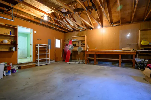a view of a room with furniture and a garage