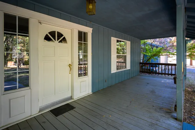 a view of front door deck and patio