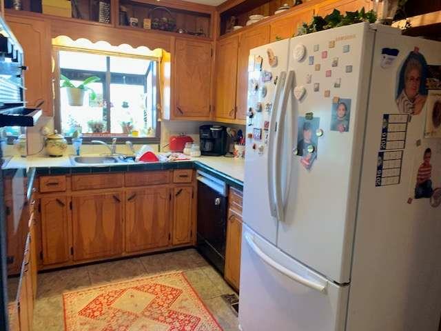 6815 Duncan Road Lula, GA 30554 - Photo 13 of 31 a kitchen with stainless steel appliances granite countertop a refrigerator and a sink