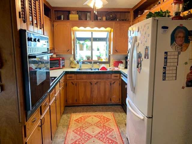 6815 Duncan Road Lula, GA 30554 - Photo 14 of 31 a kitchen with stainless steel appliances granite countertop a refrigerator and a stove