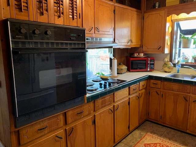 6815 Duncan Road Lula, GA 30554 - Photo 15 of 31 a kitchen with stainless steel appliances a stove and a microwave