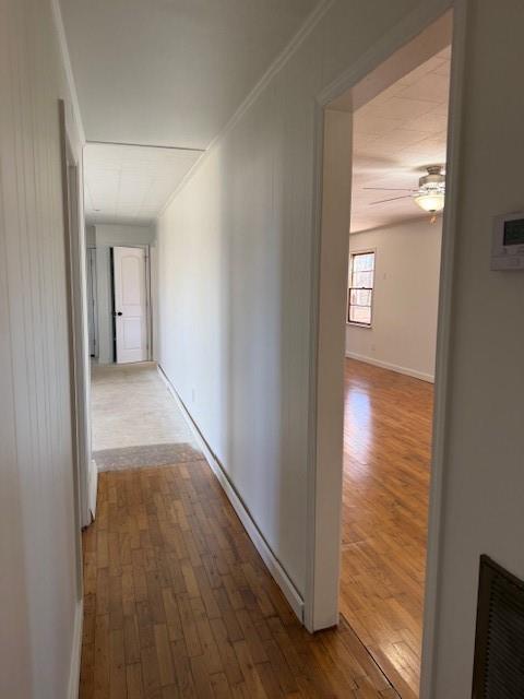 6815 Duncan Road Lula, GA 30554 - Photo 16 of 44 a view of a hallway with wooden floor and a bathroom