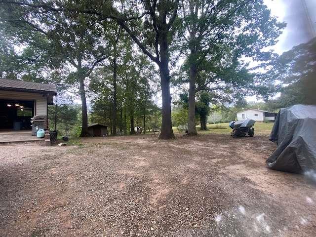 6815 Duncan Road Lula, GA 30554 - Photo 23 of 31 a view of a backyard with large trees