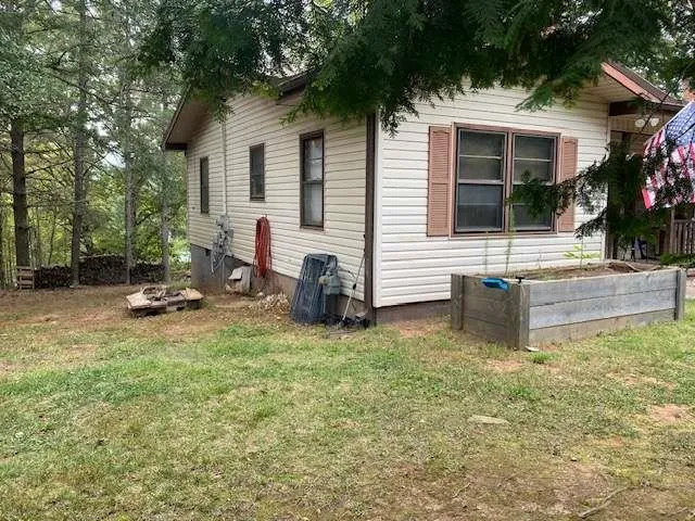 a view of backyard of a house
