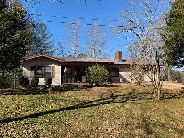 a view of a house with large windows