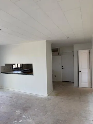 a room with furniture and window