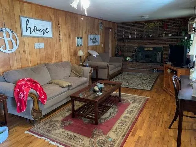 a living room with furniture and a fireplace