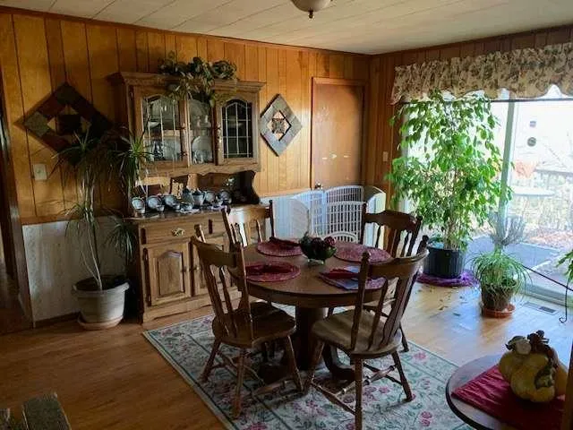 a view of a dining room with furniture window and outside view