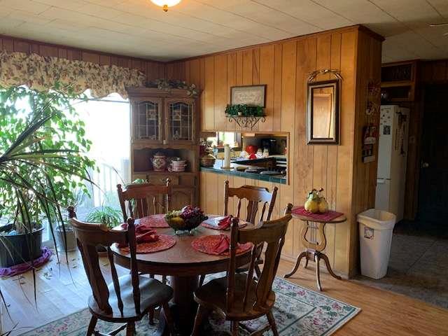 6815 Duncan Road Lula, GA 30554 - Photo 10 of 31 a view of a dining room with furniture window and wooden floor