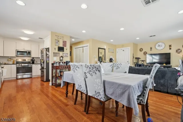 a large kitchen with a table and chairs